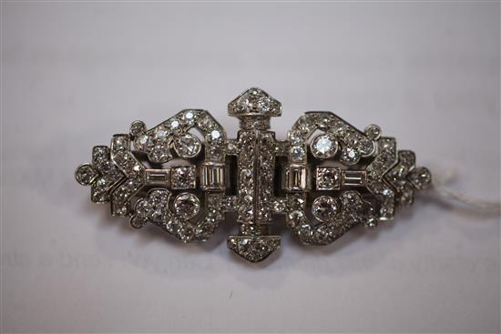A 1930s Art Deco white gold and diamond double dress clip/brooch, 2in.